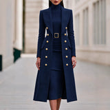Navy Blue double-breasted long coat worn over matching belted knit midi dress