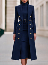 Navy Blue double-breasted long coat worn over matching belted knit midi dress