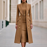 Caramel double-breasted long coat worn over matching belted knit midi dress