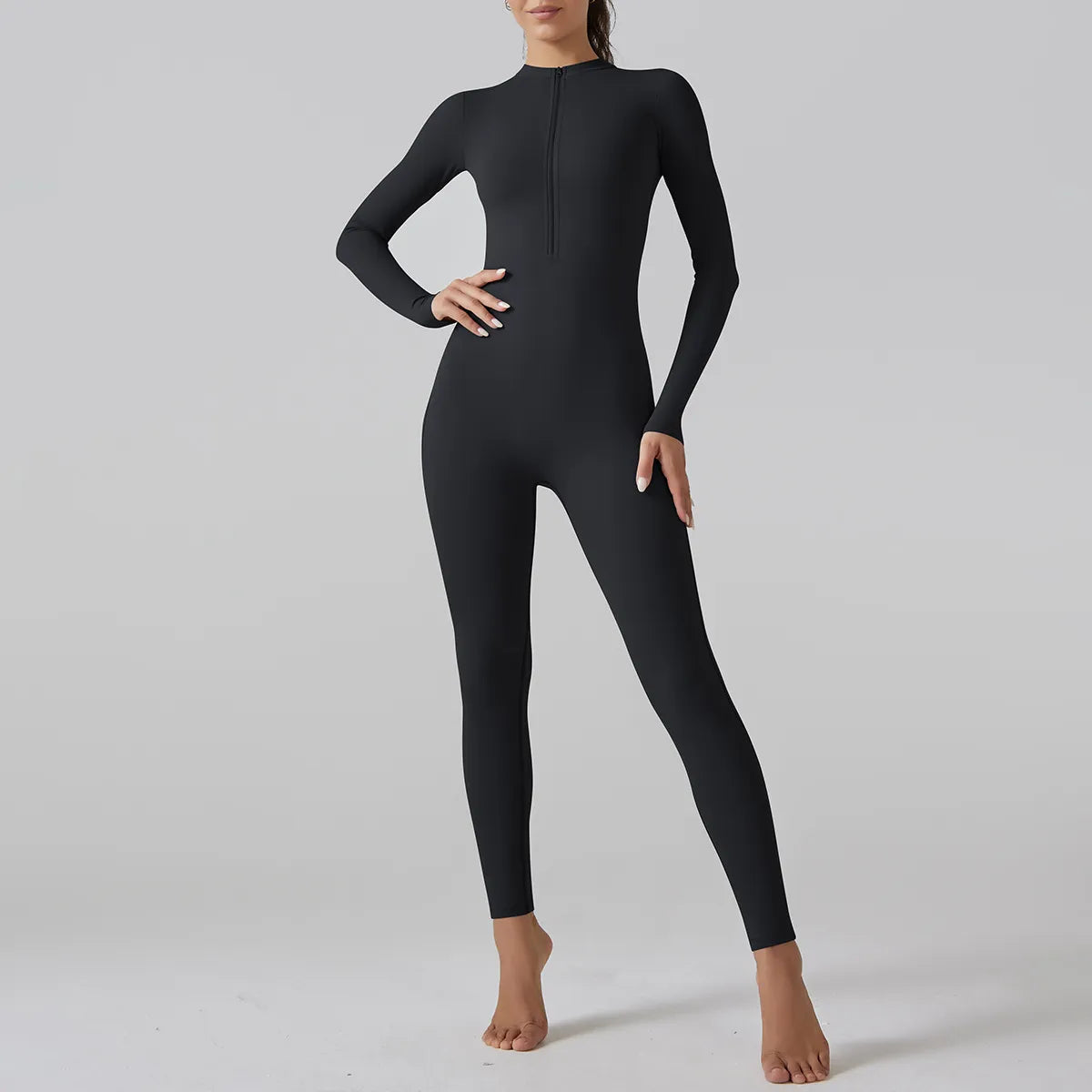 Chic Half-Zip Bodycon Jumpsuit in Black — Close-Up Detail | Enigmae