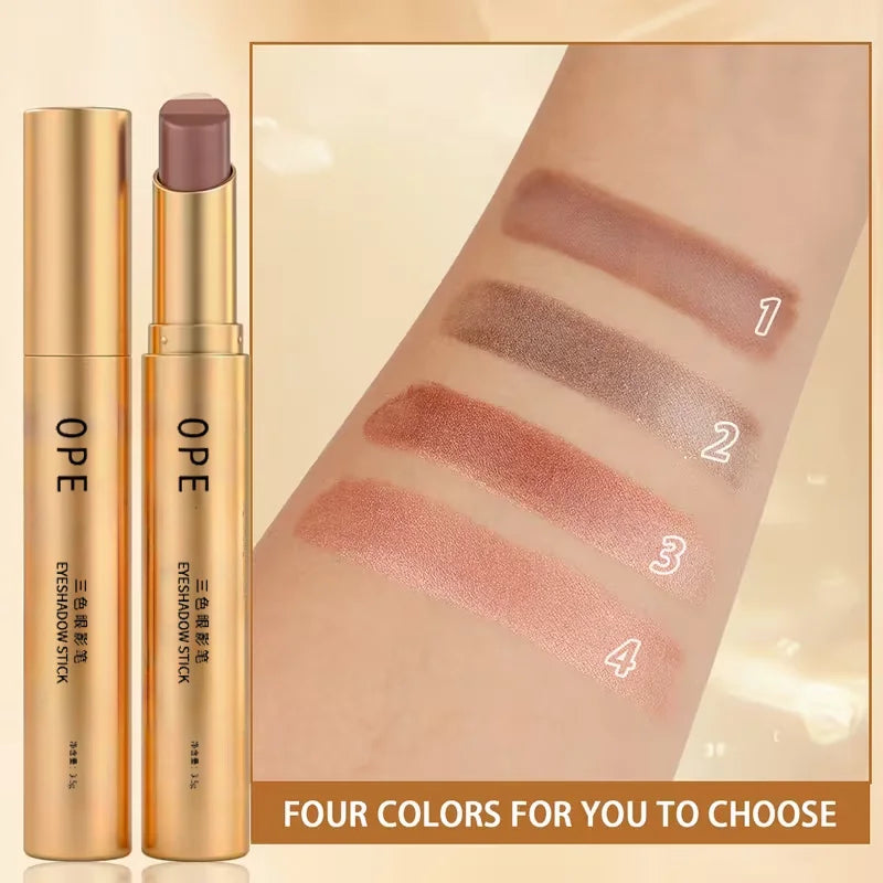 TriGlow gold eyeshadow stick and four shade swatches