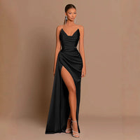 Satin spaghetti strap maxi dress shown from the side with ruched waist