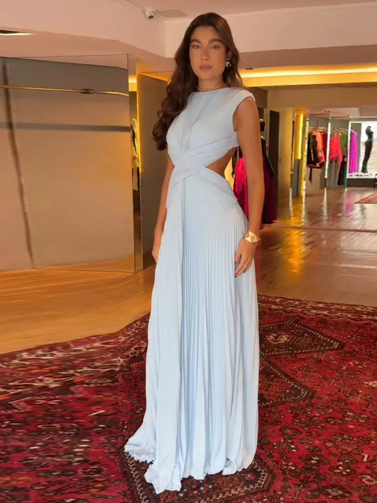 Close-up of the cut-out waist detail on the pleated A-line maxi dress