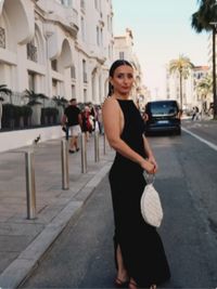 Back view of the sleeveless black gold chain evening gown