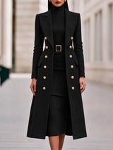 Black double-breasted long coat worn over matching belted knit midi dress