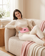 Woman relaxing on couch wearing Enigmae Ease period relief belt with heat and massage