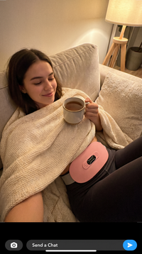 Relaxing with tea wearing the Enigmae Ease period comfort belt