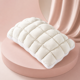 MarshmallowBreeze white puff pillow on a soft pink studio background